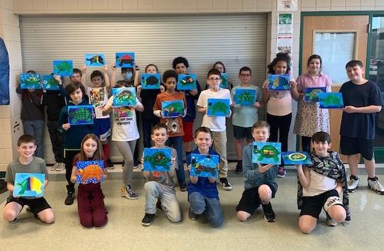 Students display their finished pieces, Whimsical Turtles