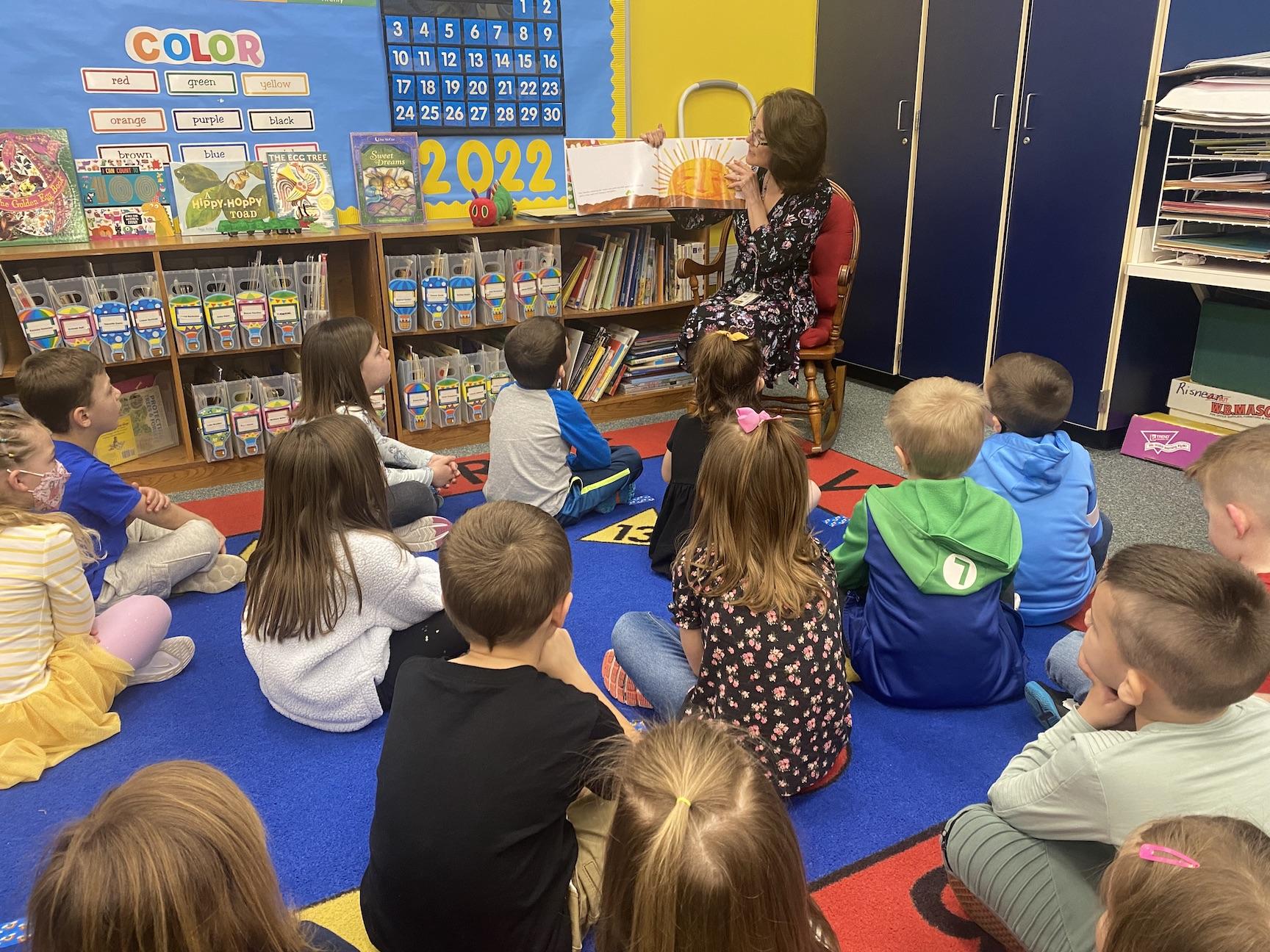 Harrison Park kindergarten teacher, Mrs. Risnear, reads a story to the children