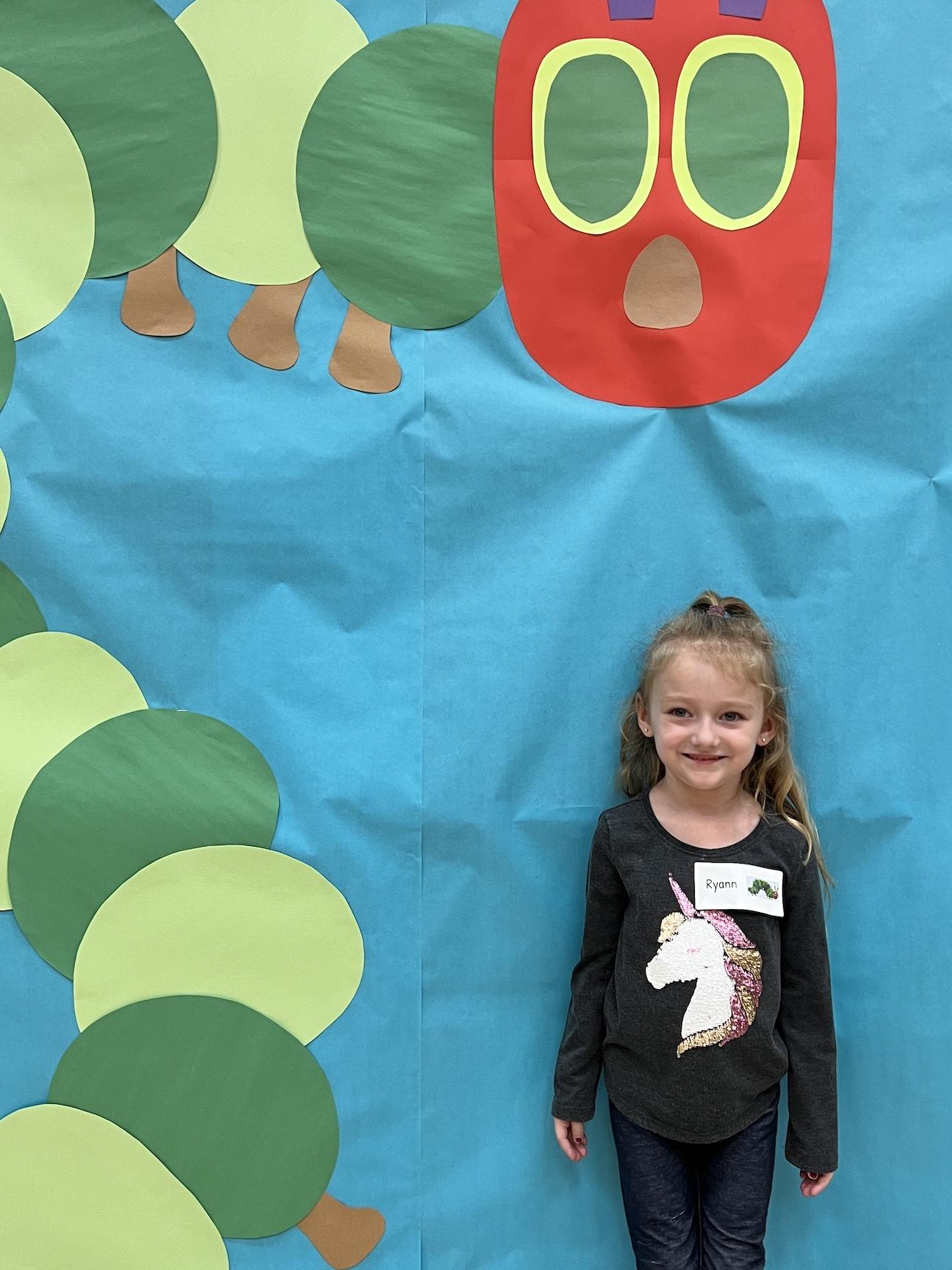 Ryann Briscoe visits the photo booth at Level Green Elementary School