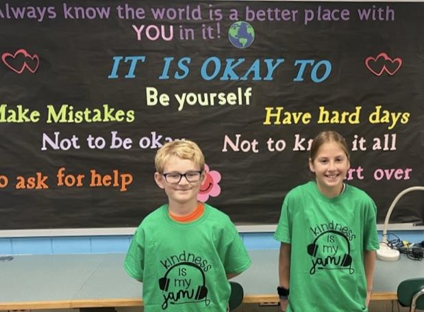 5th-graders Drake Clausner and Kiley Burnett wear their new t-shirts