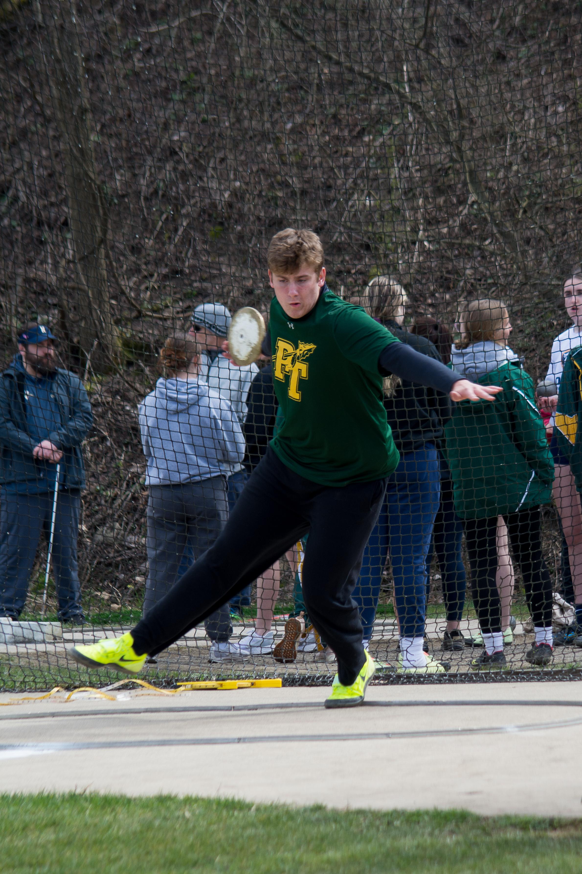 Matthew competes in the discus